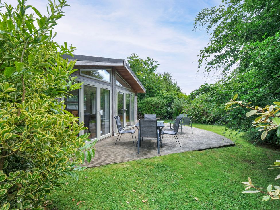 A garden with seating area and greenery at 15 Horizon View in Dobwalls