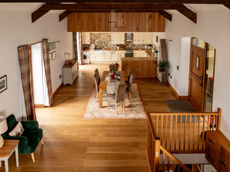 A dining room with a table and chairs at Hoppers Barn Pancrasweek near Holsworthy