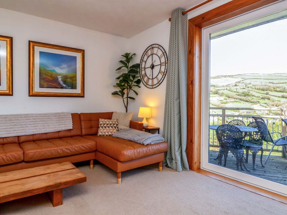 A living room with a sofa and coffee table at Hillsview in Combe Martin