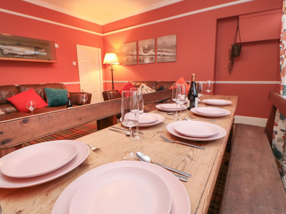 A dining room with a table set for dinner at The Smithy in Barnard Castle