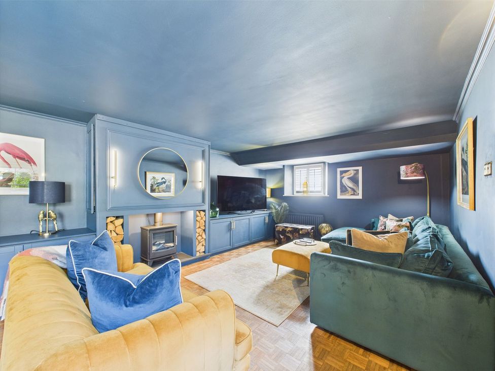 A living room with sofas and a television at The Smithy in Barnard Castle