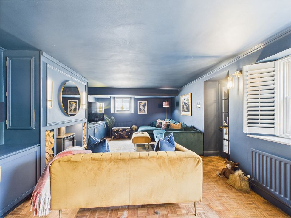 A living room with a sofa and television at The Smithy in Barnard Castle