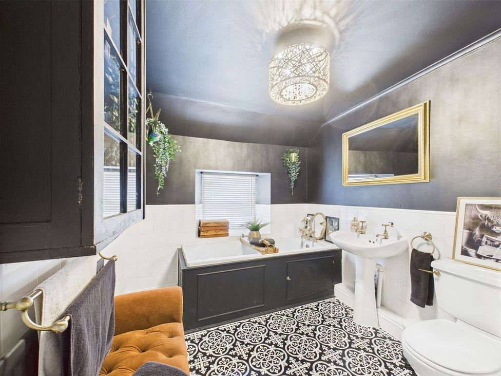 A bathroom with a bathtub and sink at The Smithy in Barnard Castle
