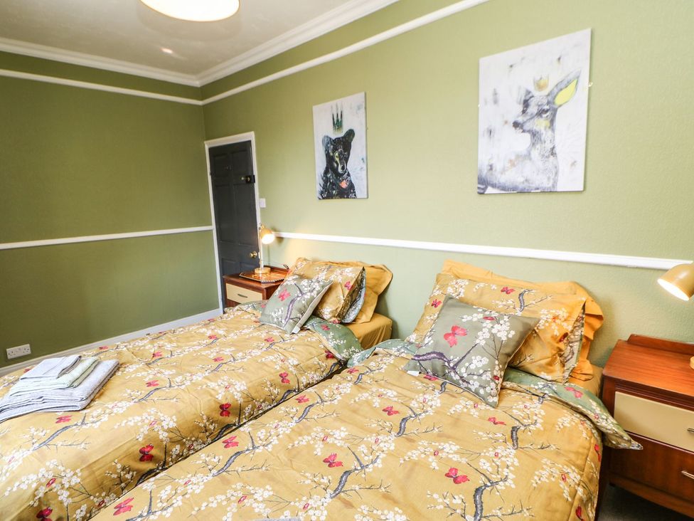 A bedroom with two beds and nightstands at The Smithy Barnard Castle