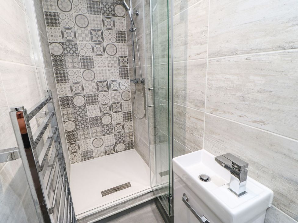 A bathroom with a shower and sink at The Smithy in Barnard Castle