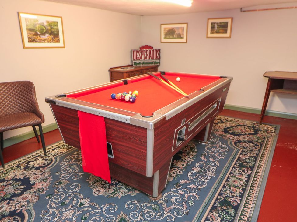 A games room with a pool table and seating area at The Smithy in Barnard Castle