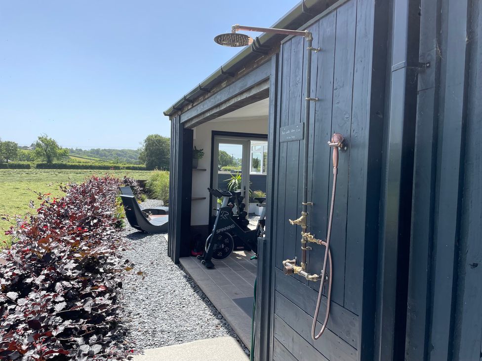 An outdoor shower and spinning bike at Ashlea Launceston
