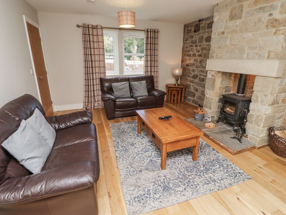 A living room with a sofa and a coffee table at Crispin in Lucker