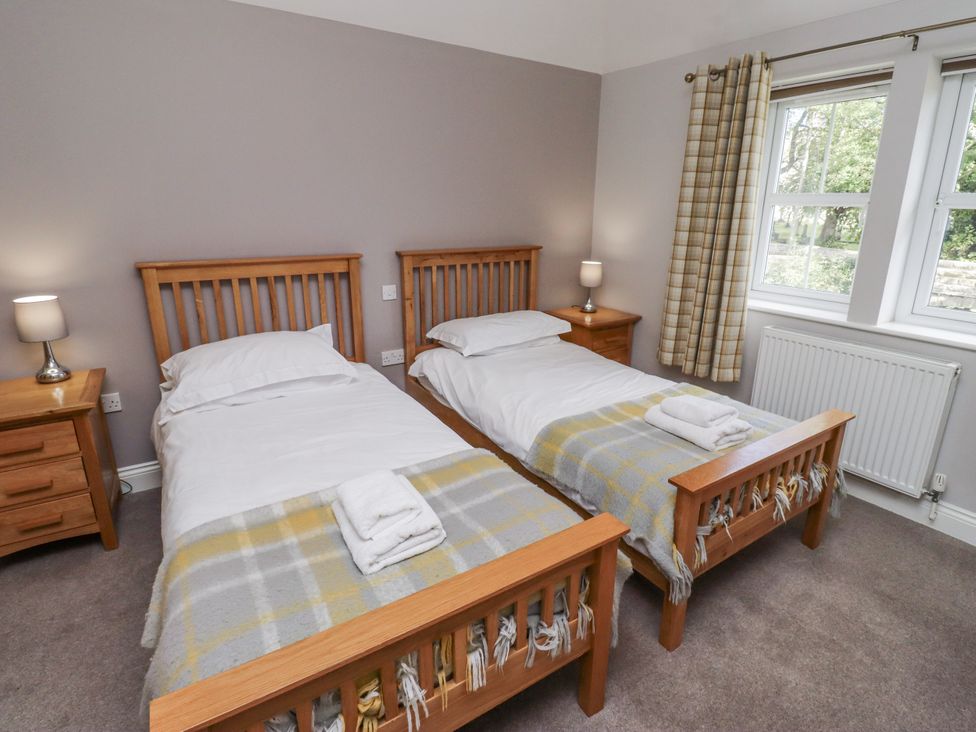 A bedroom with two beds and a window at Crispin in Lucker