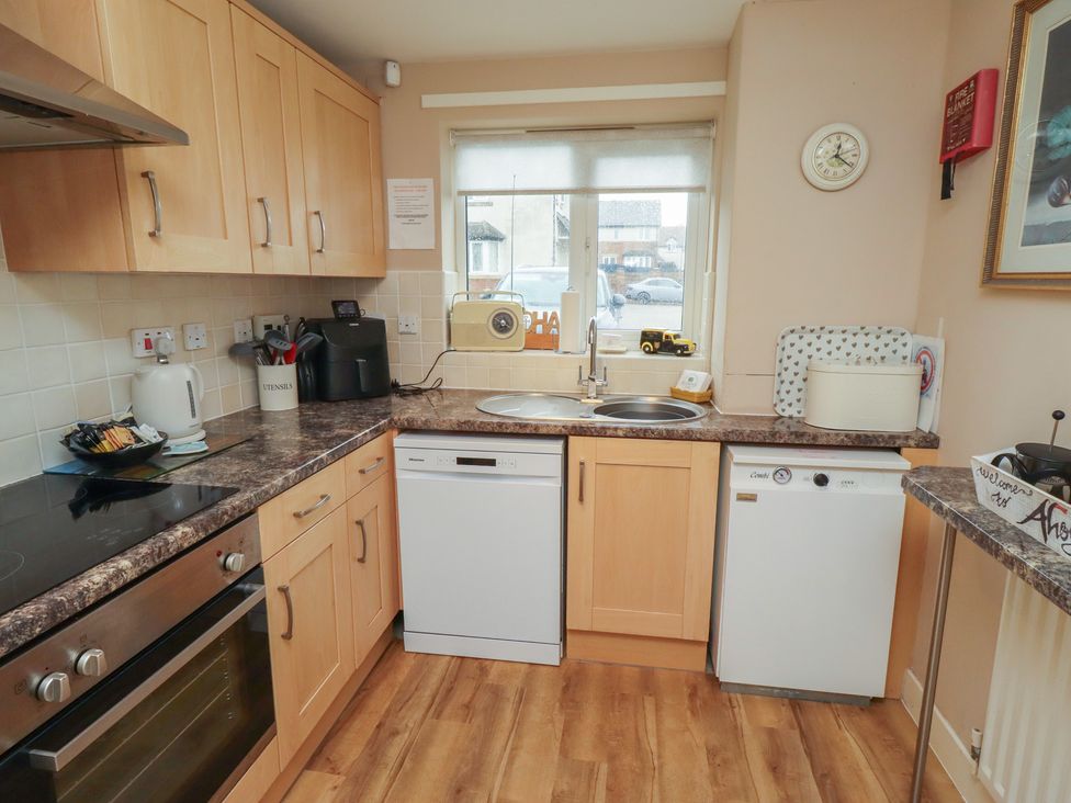 A kitchen with countertop and appliances at Ahoy in Seahouses