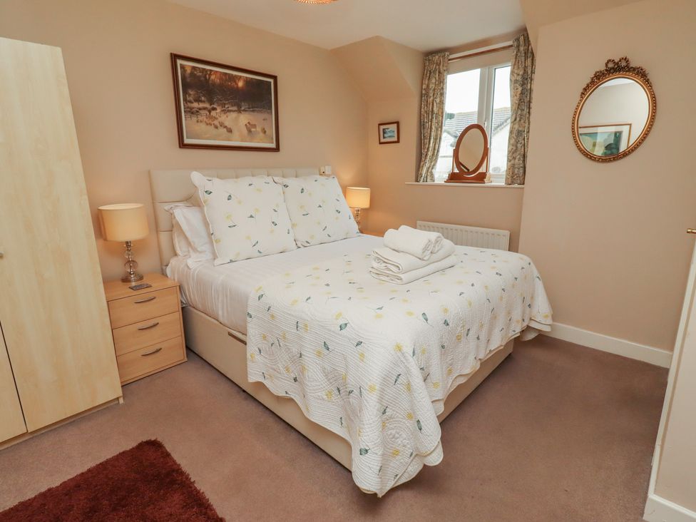 A bedroom with a bed and furniture at Ahoy in Seahouses