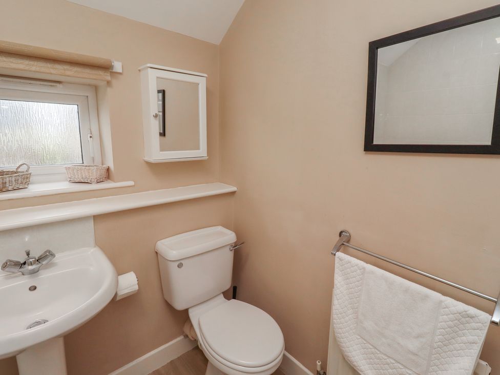 A bathroom with a sink and toilet at Ahoy in Seahouses