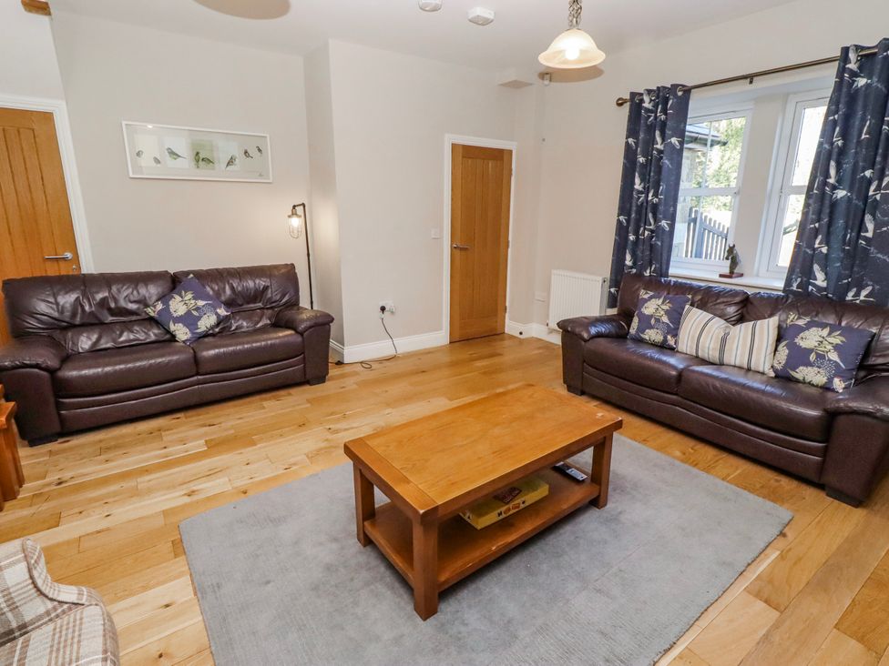 A living room with two sofas and a coffee table at Bramley in Lucker
