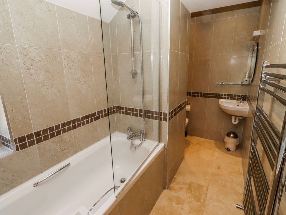 A bathroom with a bathtub and shower at Bramley in Lucker