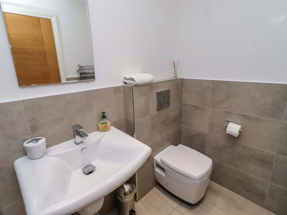A bathroom with sink and toilet at Farne Cottage Beadnell