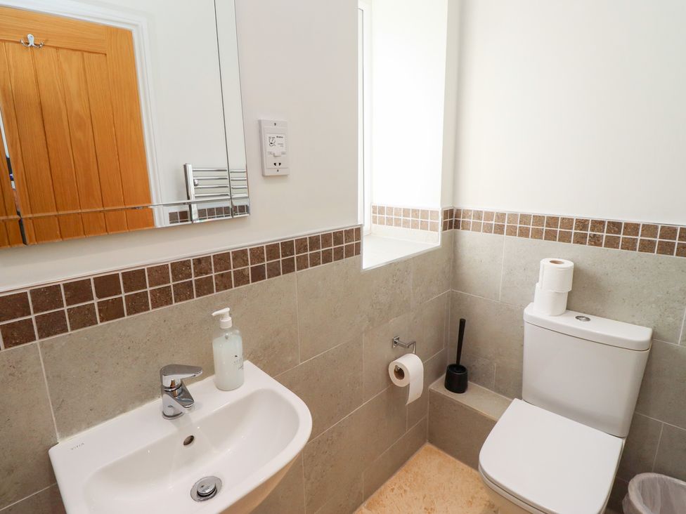 A bathroom with a sink and toilet at Russet in Lucker