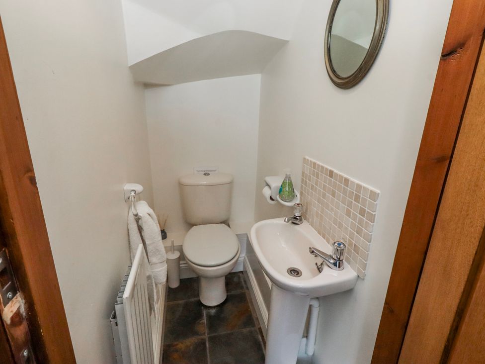 A bathroom with a toilet and sink at No9 Budle Sands in Bamburgh