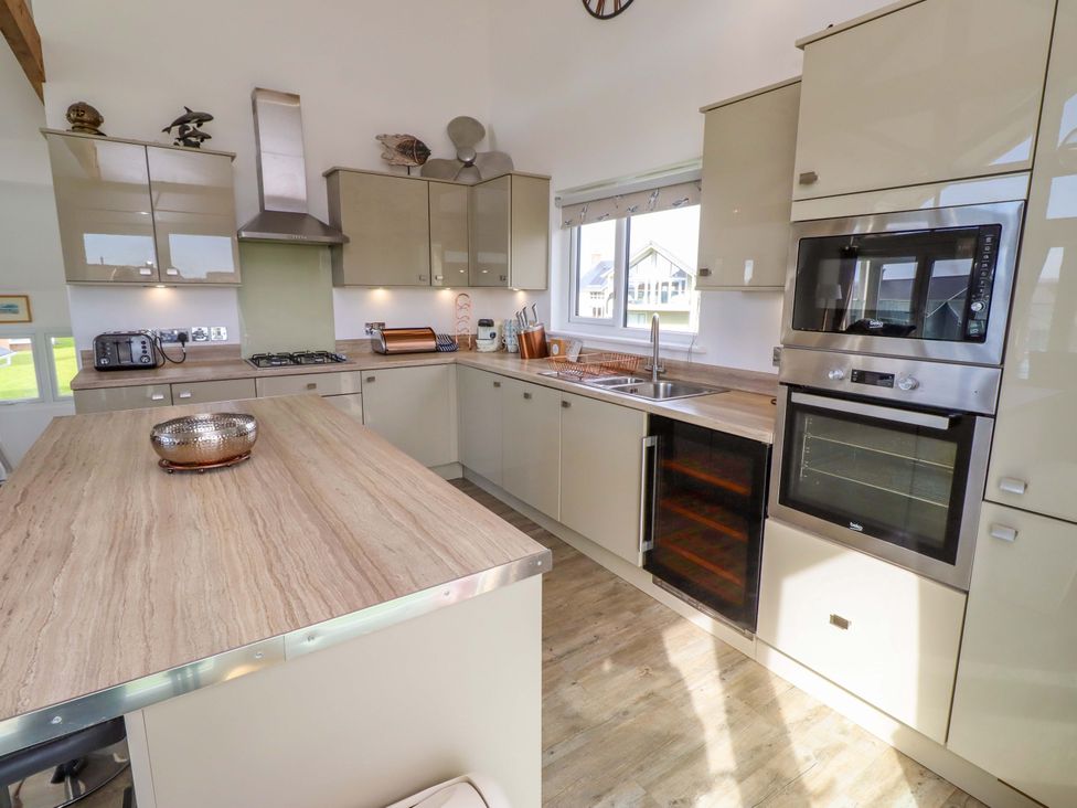 A kitchen with modern cabinets and appliances at Spindrifter Beadnell