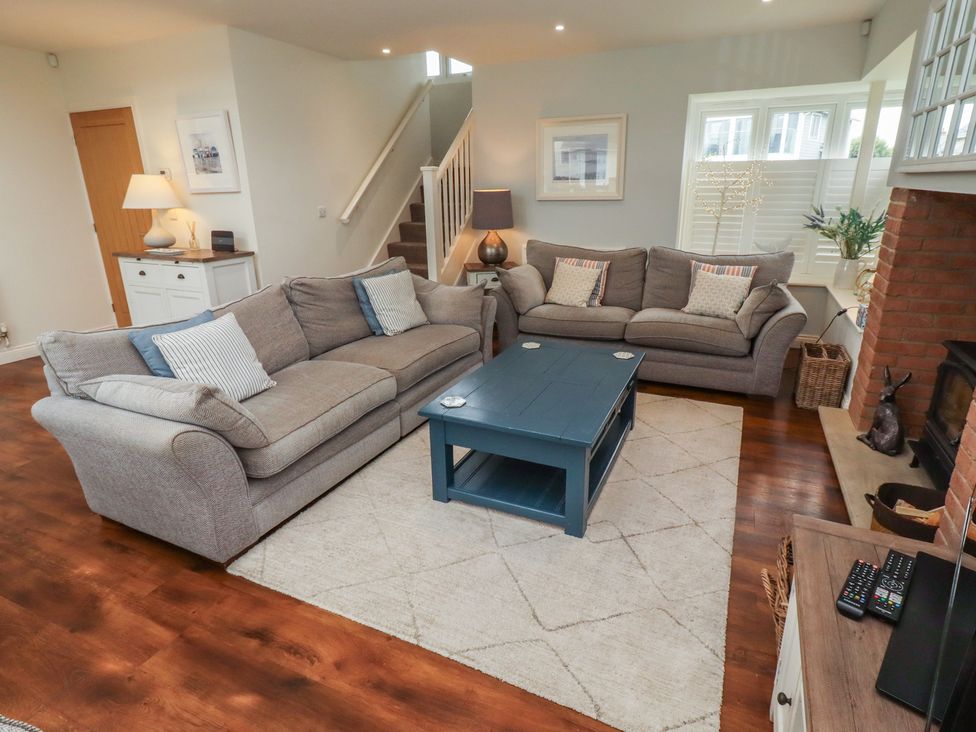 A living room with sofas and a coffee table at The Beach Hut Beadnell