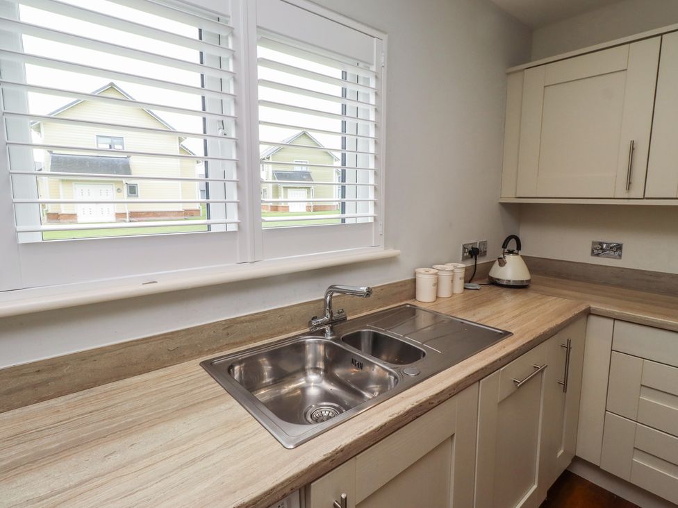 A kitchen with a sink and kettle at The Beach Hut in Beadnell