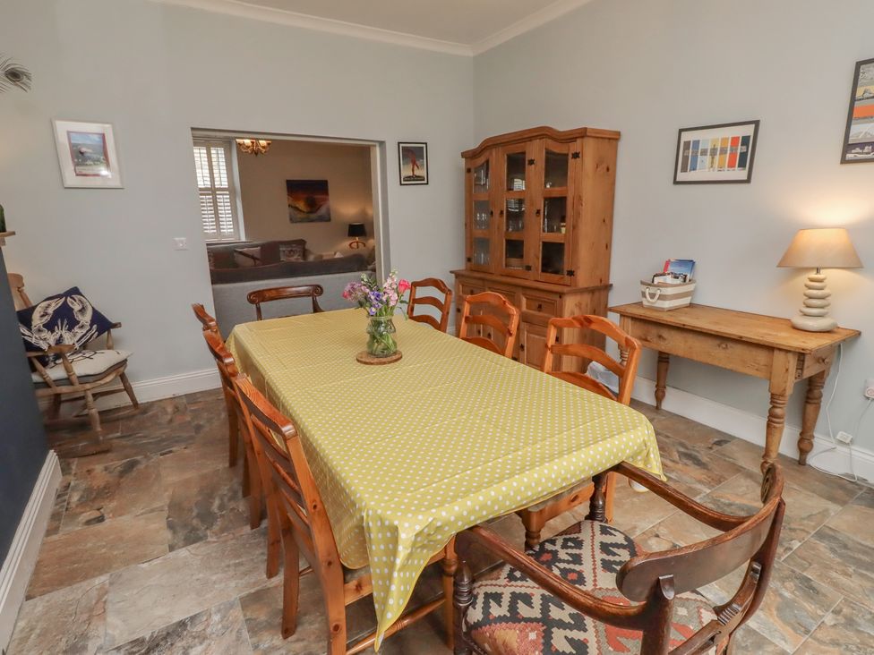 A dining room with a table and chairs at Number Seventeen Amble