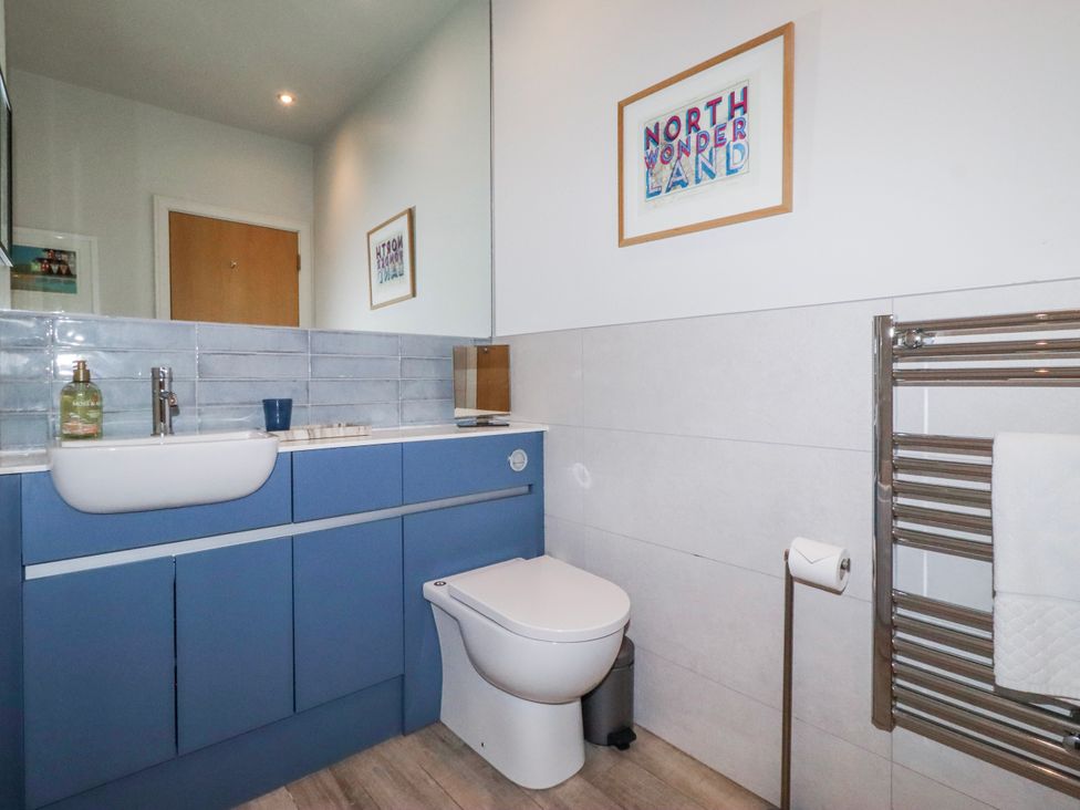 A bathroom with a sink and toilet at Cuddy's Holm in Seahouses