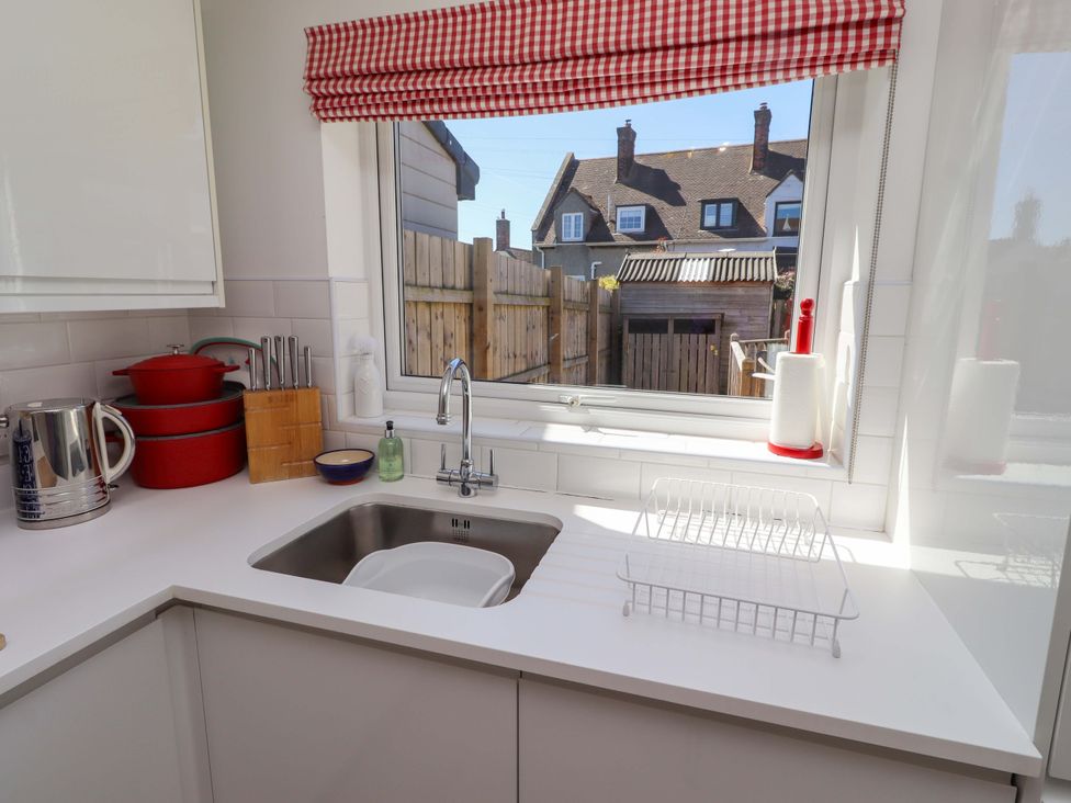 A kitchen with a sink and countertop at Dunford Cottage in Bamburgh