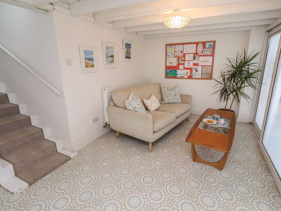 A living room with a sofa and coffee table at Dell Point in Beadnell