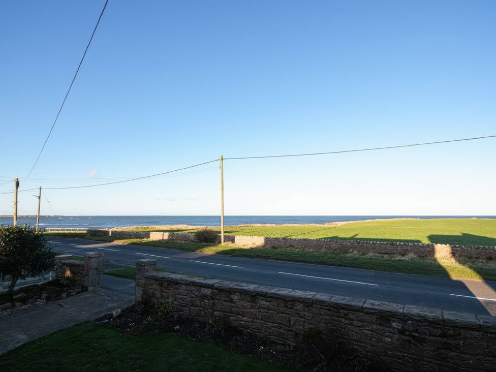 A view of the ocean and road from Dell Point in Beadnell