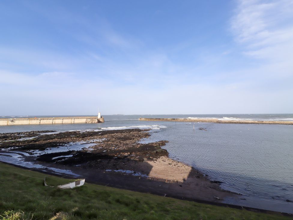 A view of the water and pier at Old Bakery No2 Seahouses
