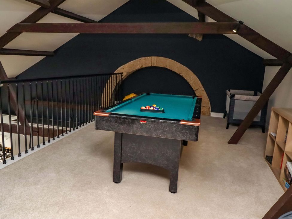 A games room with a pool table and railing at Treetops, Alnwick