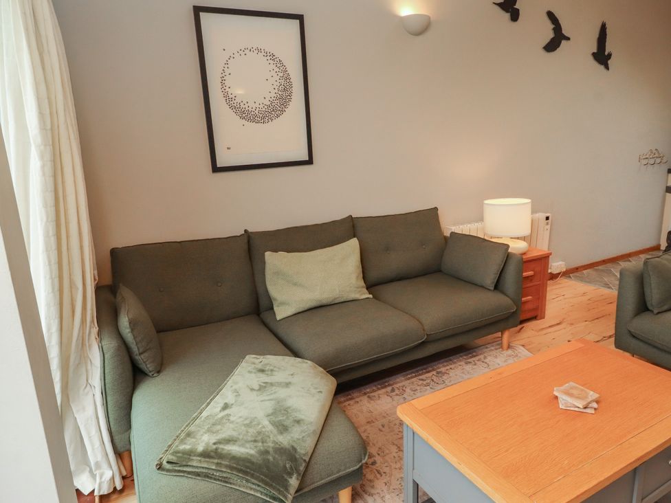 A living room with a sofa and coffee table at Links View in Embleton