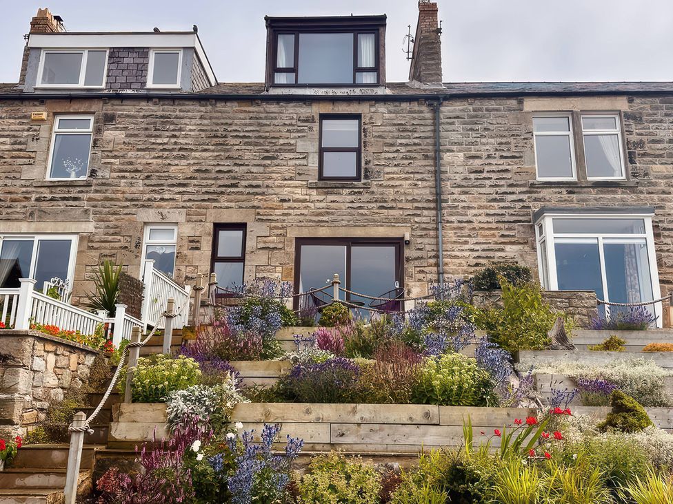 A house with plants and steps at Old Coastguard Cottages Amble