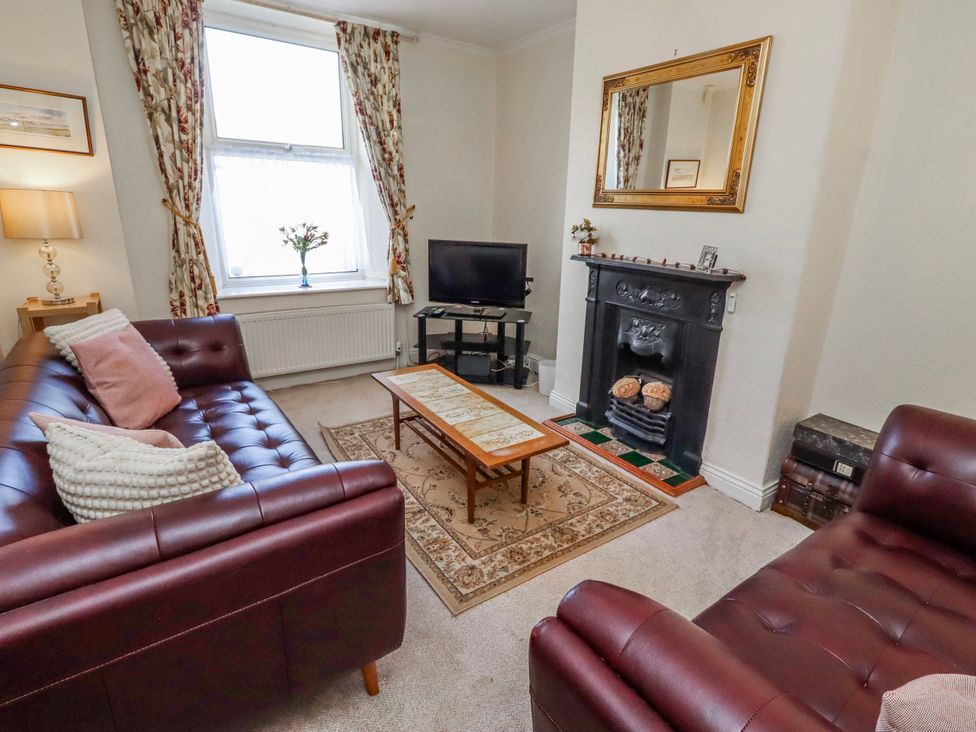 A living room with a sofa and table at Hardys House in Alnwick