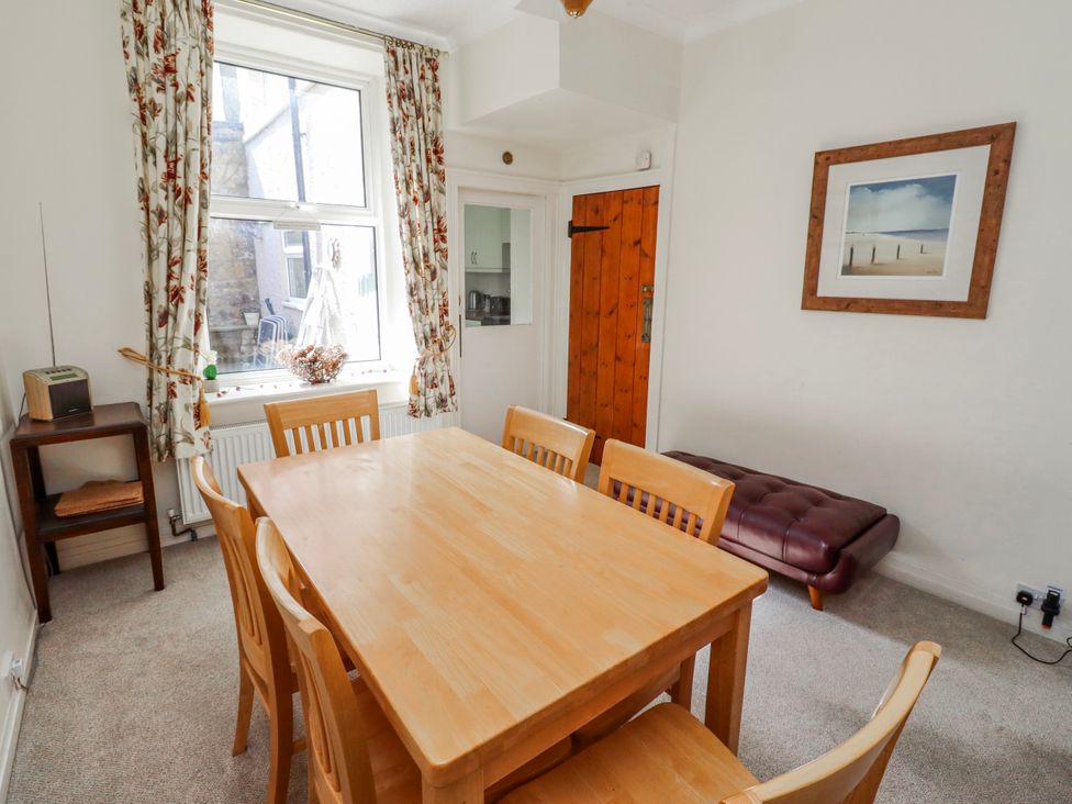 A dining room with a table and chairs at Hardys House Alnwick