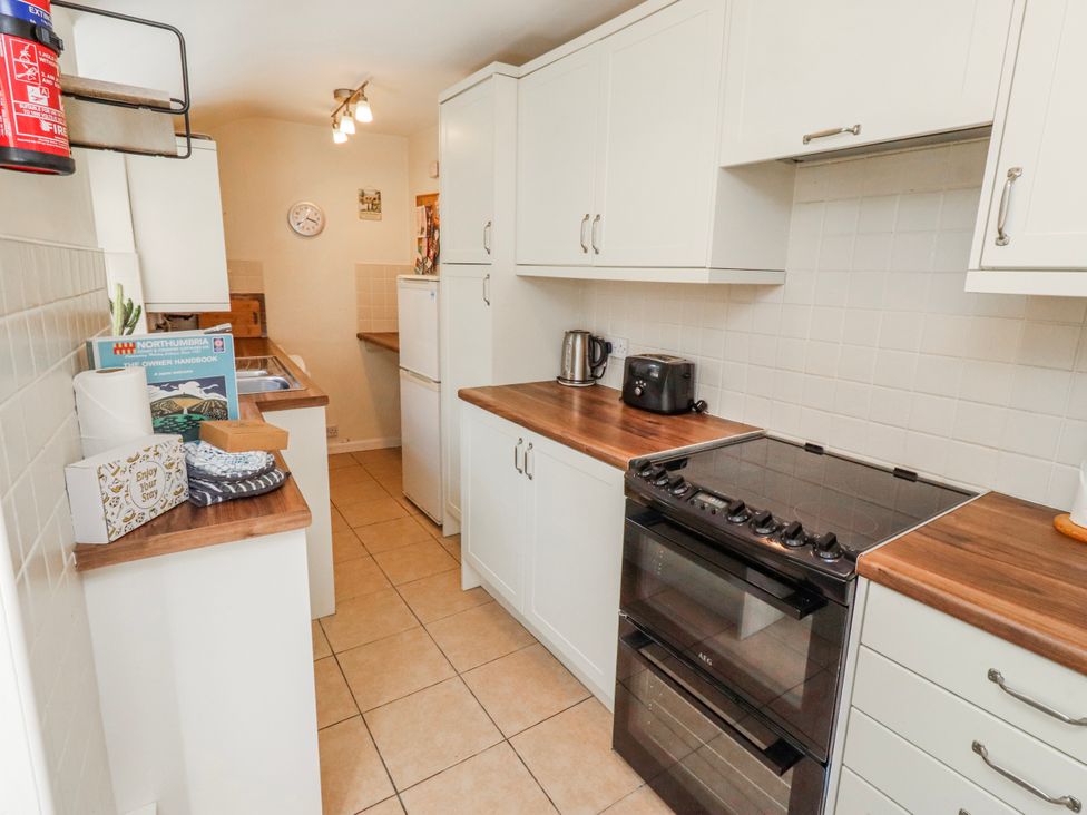 A kitchen with appliances and cabinetry at Hardys House Alnwick