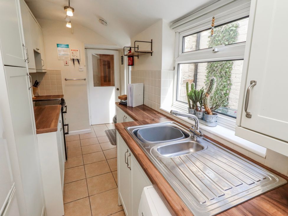 A kitchen with a sink and window at Hardys House in Alnwick