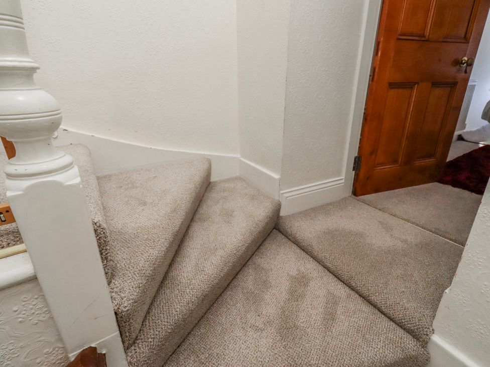 A staircase leading to a hallway at Hardys House Alnwick