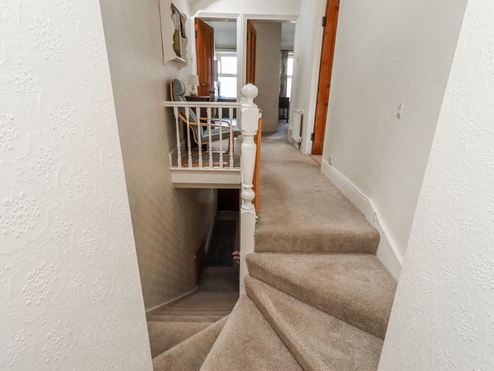 A staircase leading to a hallway at Hardys House in Alnwick