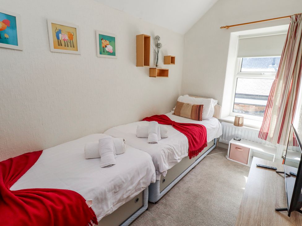A bedroom with two beds and decorations at Hardys House in Alnwick