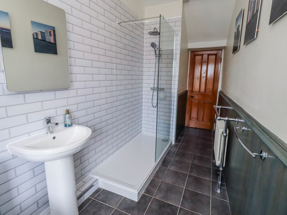 A bathroom with a shower and sink at Hardys House in Alnwick
