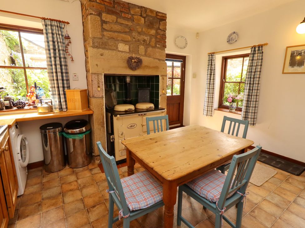 A kitchen with a table and chairs at Lavender Cottage (Bailiffgate) Alnwick