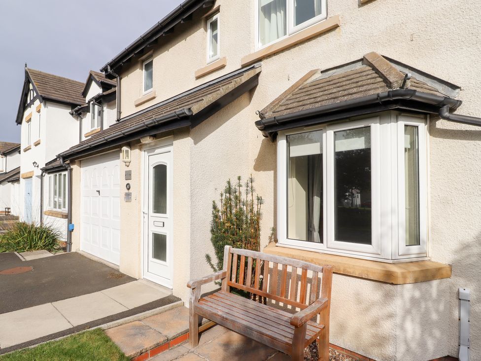 A house with a front door and garden area at Beach View in Seahouses