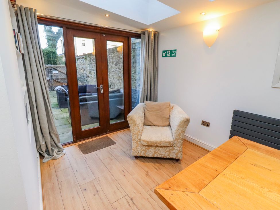 A dining room with a table and chair at Alnbank in Alnmouth