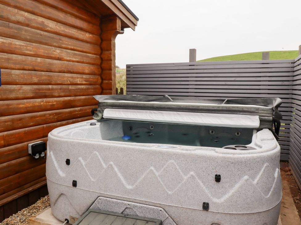 A hot tub in an outdoor area at Heather Cottages - Brown Owl, Bamburgh