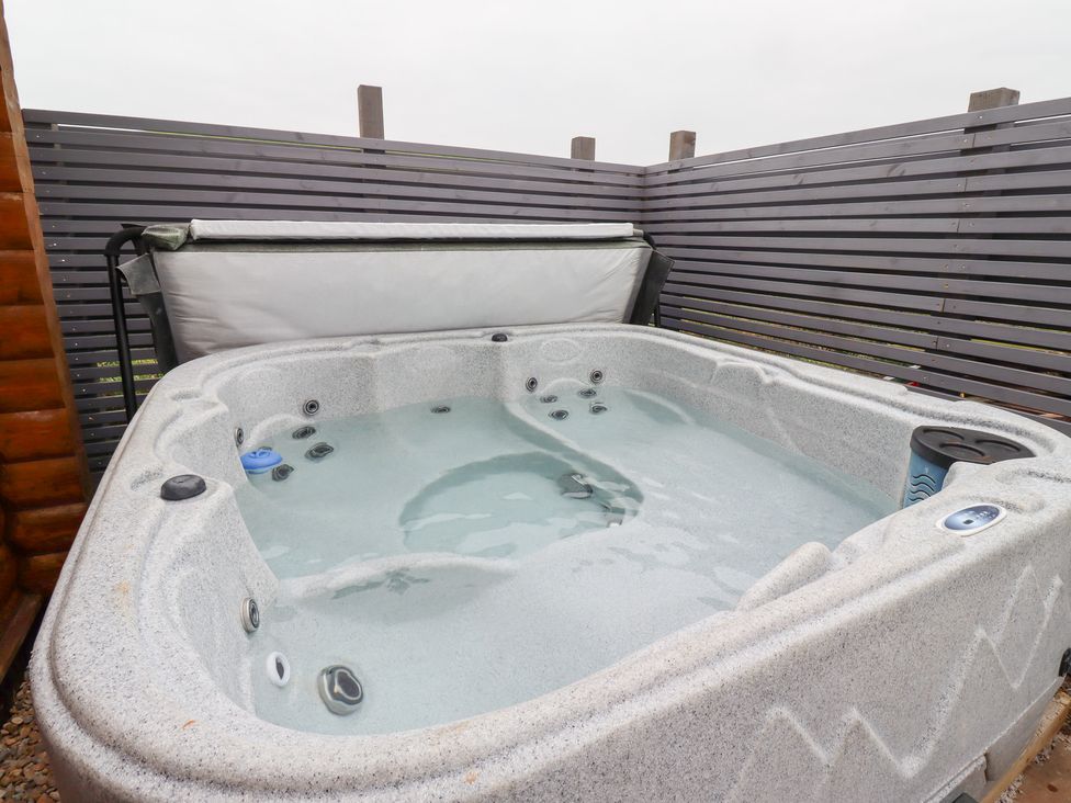 A hot tub in an outdoor area at Heather Cottages - Brown Owl in Bamburgh