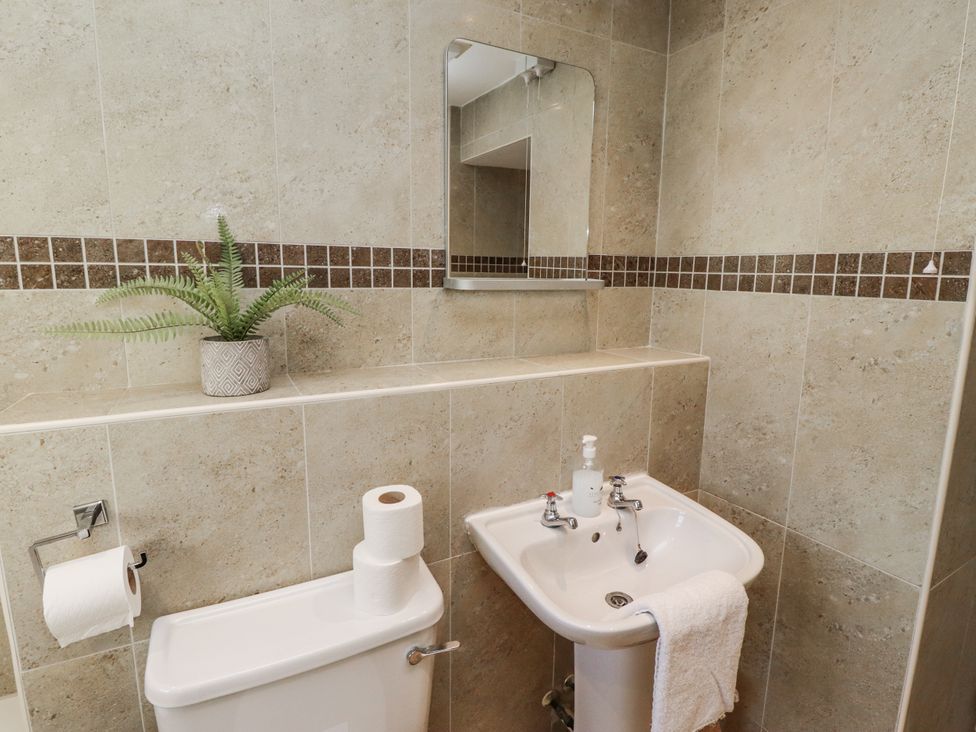A bathroom with a sink and toilet at Heather Cottages - Godwit in Bamburgh