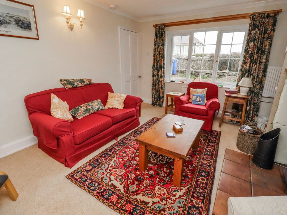 A living room with two sofas and a coffee table at St Marys Cottages No4 Low Newton-by-the-Sea