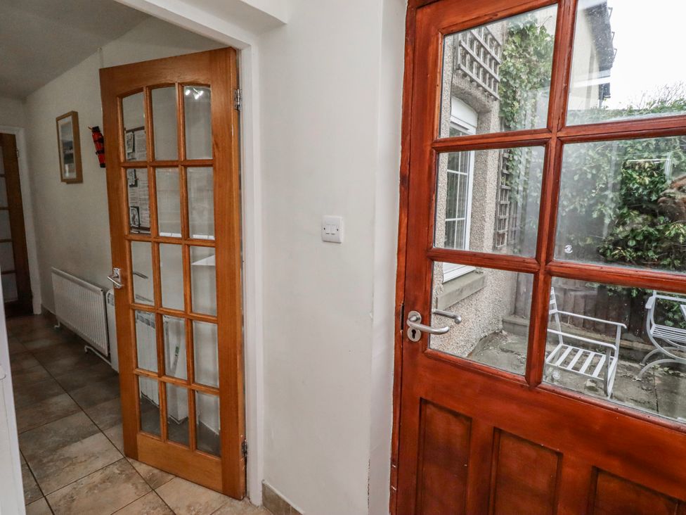 A hallway with a door and window at St Marys Cottages No4 Low Newton-by-the-Sea