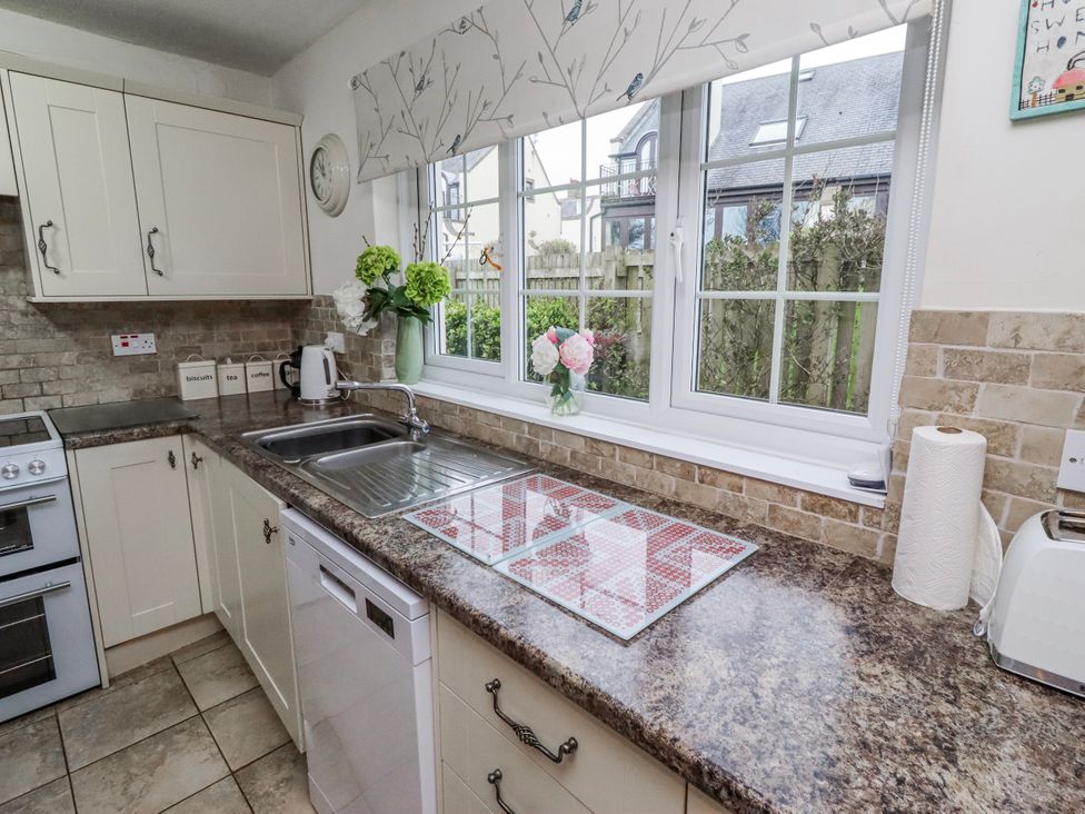 A kitchen with a sink and window at St Marys Cottages No4 Low Newton-by-the-Sea